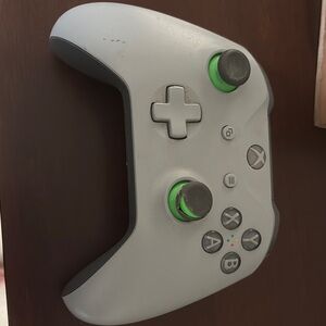Gray and Black Gaming Controller with Green Accents